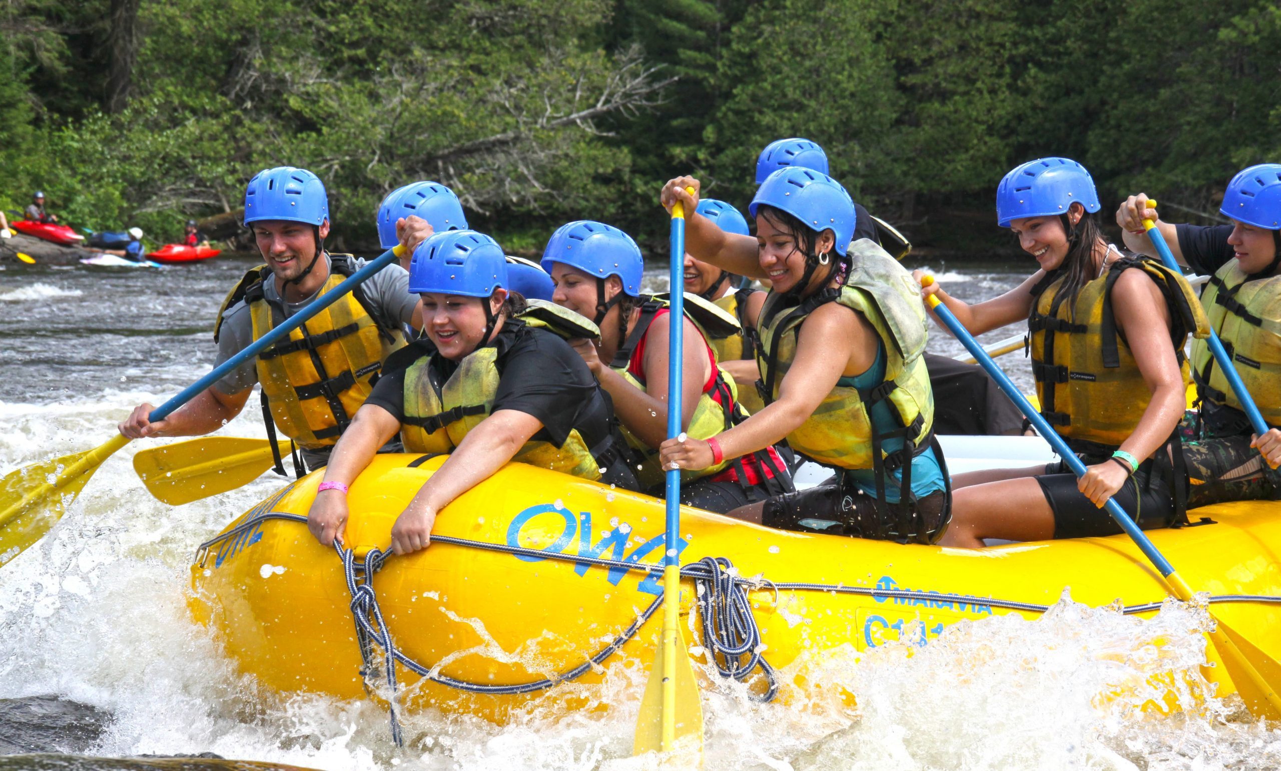 Action shot of a group white water rafting