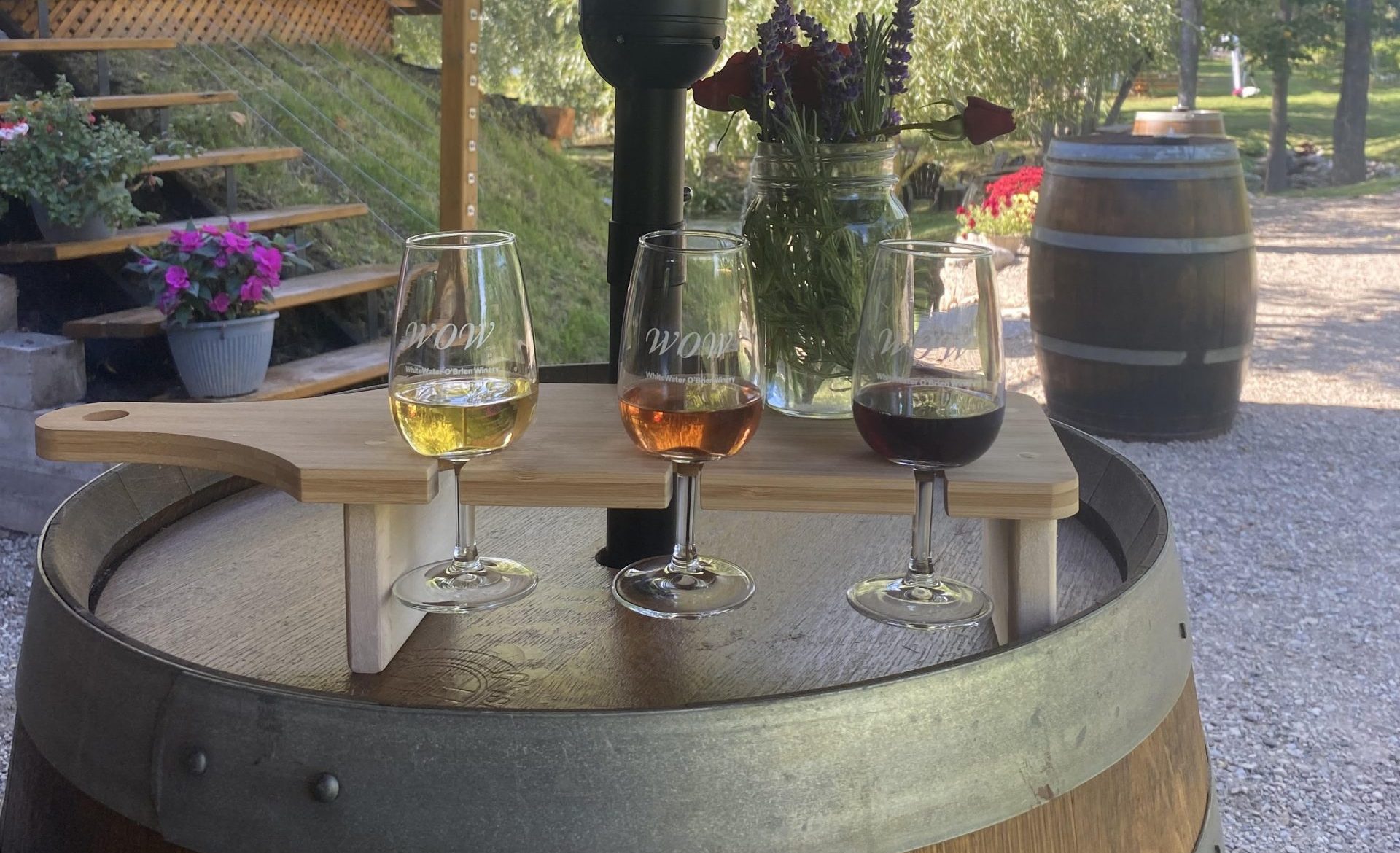 A flight of wine on an oak barrel